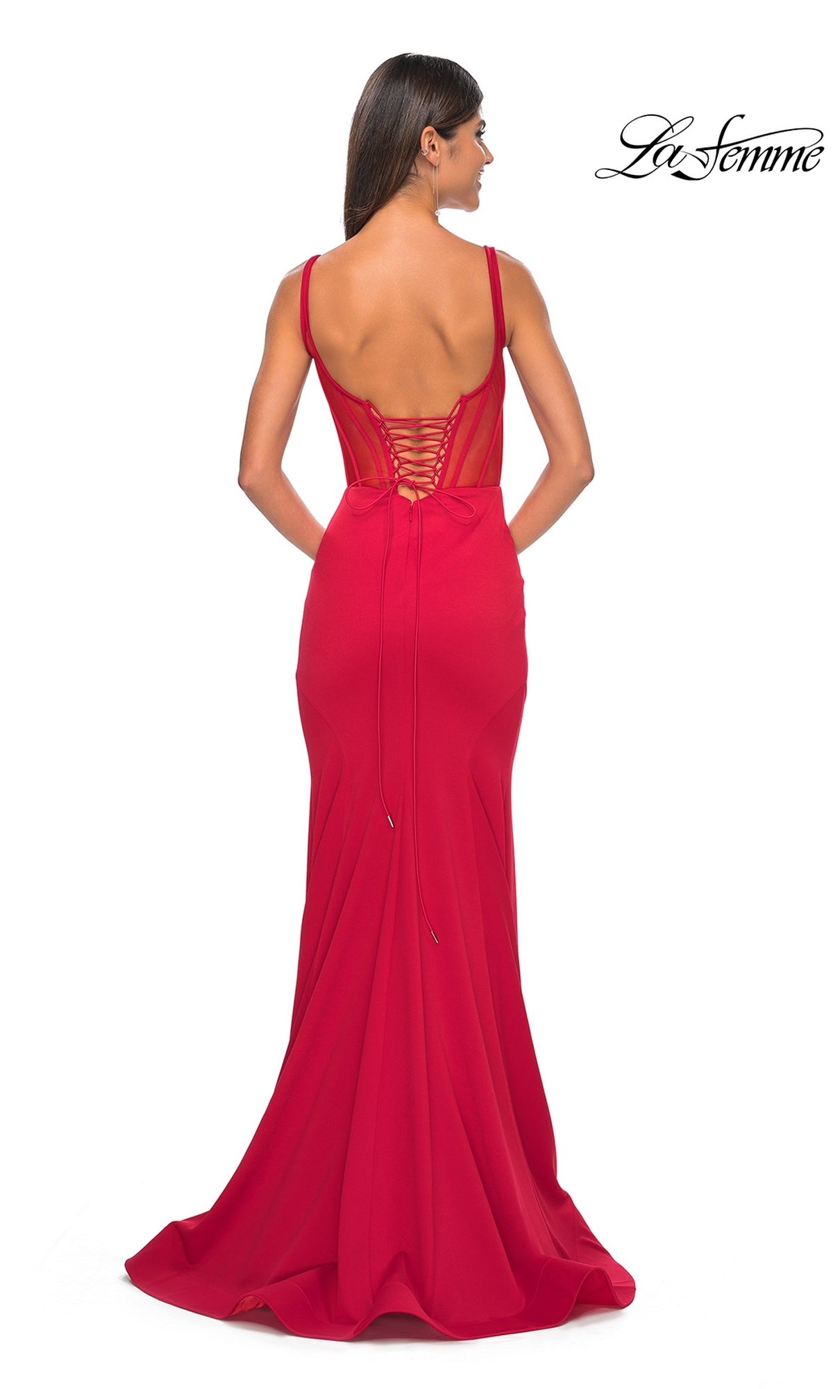 A woman seen from behind wears the La Femme Lace-Up Sheer Back Long Prom Dress 32268—a fitted, floor-length red gown with thin straps, a corset-style bodice, and lace-up open back. The La Femme logo appears in the top right corner.